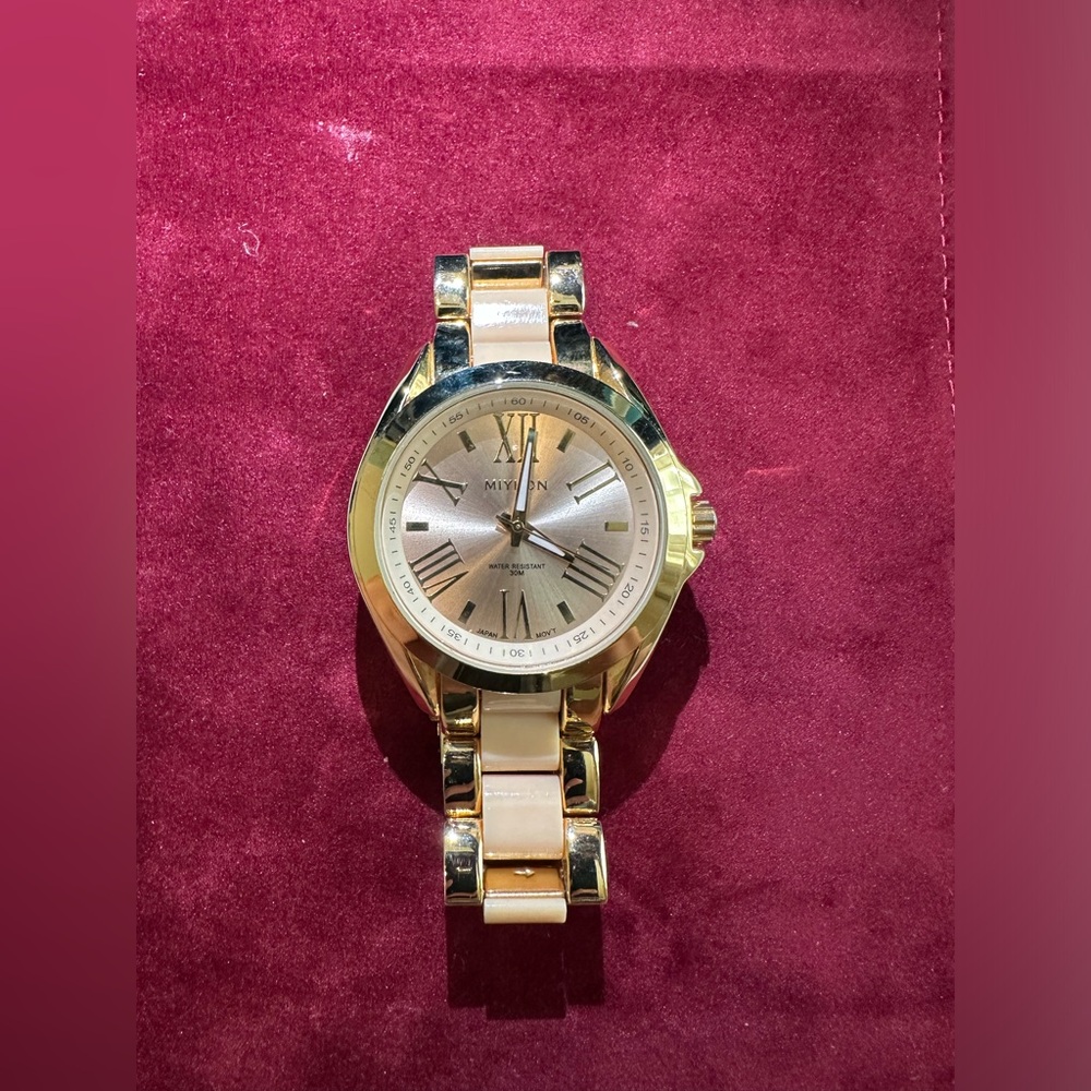 Miykon women’s gold watch